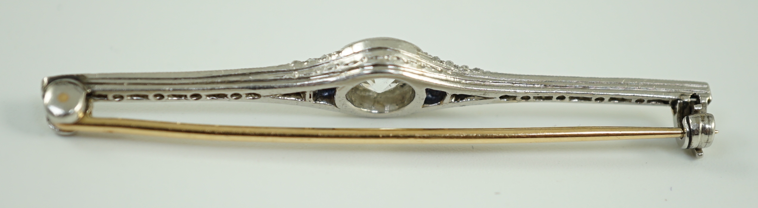 A 1920's platinum and gold, diamond and synthetic? sapphire set bar brooch